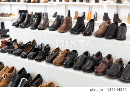Showcase with casual stylish shoes 126144232