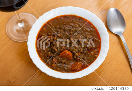 Red lentil soup with carrots and pork pieces 126144589