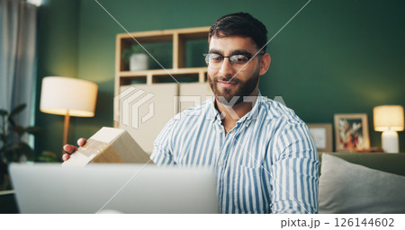 Box, package and man with laptop on sofa for delivery for online shopping, ecommerce and shipping. Happy, living room and person with parcel on computer for checklist, digital receipt and invoice Box, package and man with laptop on sofa for delivery for online shopping, ecommerce and shipping. Happy, living room and person with parcel on computer for checklist, digital receipt and invoice 126144602
