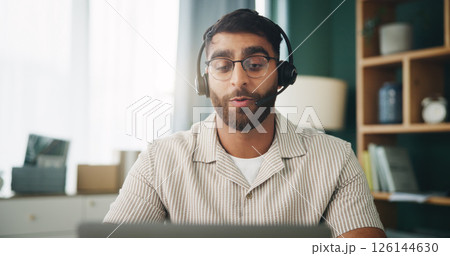 Home, man and laptop for remote work in customer service, IT or tech support. Agent, headset or help for communication, advice or freelancer troubleshooting for software solution on call with contact 126144630