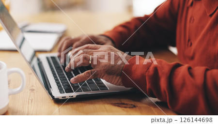 Laptop, hands and man typing in home office for article, news or research for remote work. Freelance journalist, keyboard and mature person writing report, editing or creative publication on internet 126144698