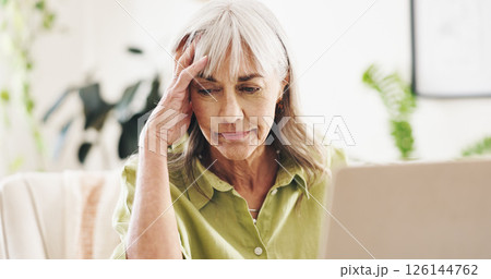 Worry, stress and laptop with old woman at home for retirement fund savings, life insurance payment and anxiety. Tax audit, bankruptcy and loan interest with senior person in apartment for debt 126144762