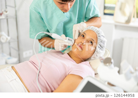 doctor confidently wields cold hammer whitening 126144958