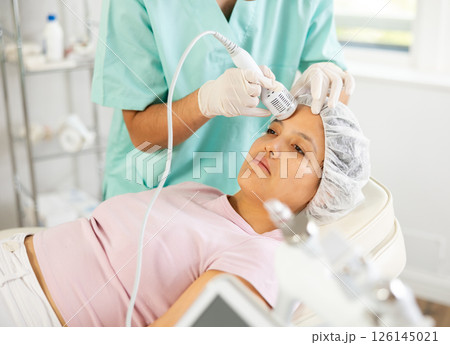 doctor confidently wields cold hammer whitening 126145021