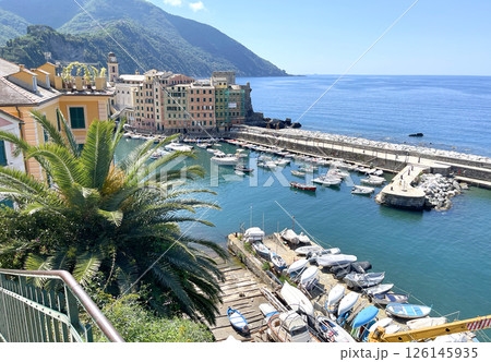 Liguria and old traditional building, boats. Camolli town by sea. Panoramic view with mountain. Tourism and vacation. Liguria and old traditional building, boats. Camolli town by sea. Panoramic view with mountain. Tourism and vacation. 126145935