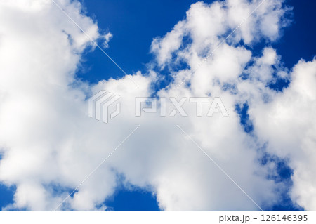 A beautiful blue sky filled with fluffy white clouds in it A beautiful blue sky filled with fluffy white clouds in it 126146395