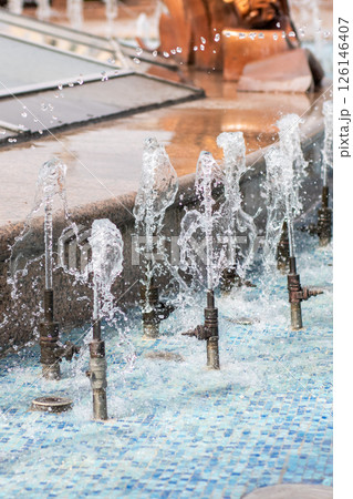 Closeup view of a beautiful fountain with water spraying out 126146407