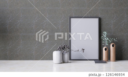 A modern interior featuring a textured wall, minimalist vases, a blank picture frame. 3d rendering. 126146934