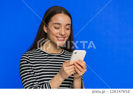 Woman use smartphone typing new post on web message browsing addiction of social networks play game Woman use smartphone typing new post on web message browsing addiction of social networks play game 126147658