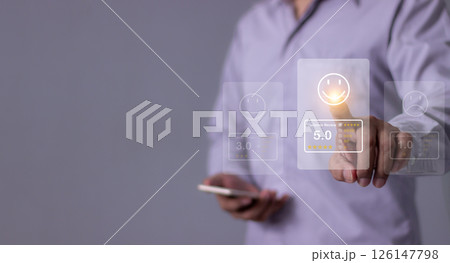 Young Man with smartphone mobile hand touch emoji five star to review and give 5 stars  126147798