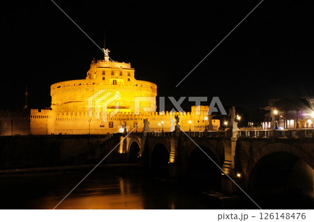 Illuminated Castel Sant Angelo and Ponte Sant Angelo over Tiber River at night in Rome with reflections on water historical architecture and iconic view Illuminated Castel Sant Angelo and Ponte Sant Angelo over Tiber River at night in Rome with reflections on water historical architecture and iconic view 126148476