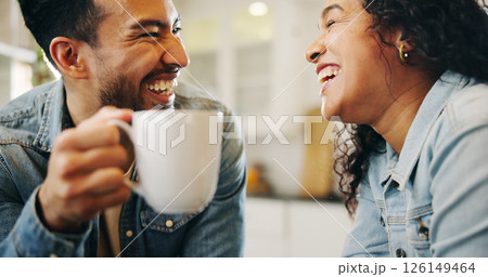 Couple, laughing and drinking coffee with smile in home for gossip, happy and funny conversation in kitchen. Man, woman and bonding with beverage in house for support and relax with comic morning 126149464