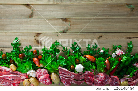 Natural border with lamb and greens Natural border with lamb and greens 126149484