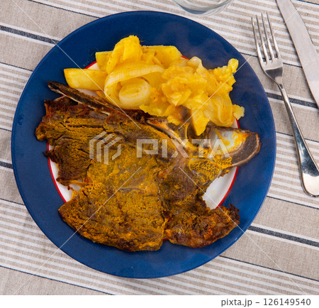 Tasty beef entrecote with mashed potatoes and onion Tasty beef entrecote with mashed potatoes and onion 126149540