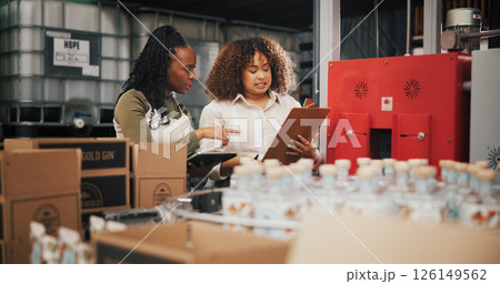 Distillery, team and inspection with women in factory for packaging, drink production and bottle checklist. Manufacturing, inventory and distribution with people in warehouse for quality control Distillery, team and inspection with women in factory for packaging, drink production and bottle checklist. Manufacturing, inventory and distribution with people in warehouse for quality control 126149562