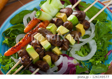 Chicken hearts skewers with avocado Chicken hearts skewers with avocado 126149577