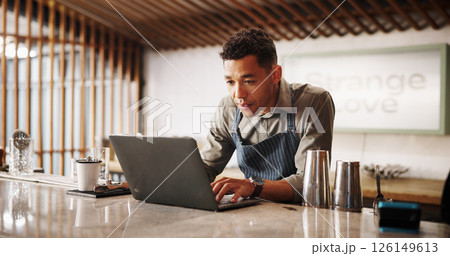 Cocktail, cafe and bartender man with laptop for recipe research, stock management or online order. Mixology, drinks or server on website for inventory checklist, menu planning and small business Cocktail, cafe and bartender man with laptop for recipe research, stock management or online order. Mixology, drinks or server on website for inventory checklist, menu planning and small business 126149613