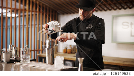 Cocktail, mixology and bartender man with bottle, jigger or tools for artisan beverage recipe. Cafe, small business pub and barman at counter with happy hour drinks, process or craft alcohol in glass Cocktail, mixology and bartender man with bottle, jigger or tools for artisan beverage recipe. Cafe, small business pub and barman at counter with happy hour drinks, process or craft alcohol in glass 126149628