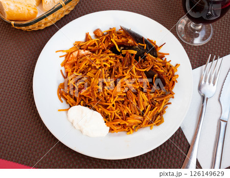 Seafood fideua, rich in taste, unforgettable dish 126149629