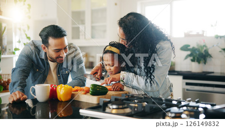 Kitchen, family and help with vegetables for cooking, nutrition and bonding together in home. Daughter, man and woman with chopping board for meal prep, teaching and support with girl and mother 126149832