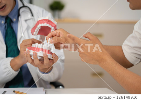 Dentist working tooth model, dentistry and recommend patient concept. 126149910
