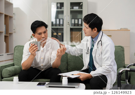 Stressed male patient are treated by a psychologist or psychiatrist in a psychiatric clinic or hospital. Patients reported symptoms of depression, stress, irritability, and life problems. 126149923