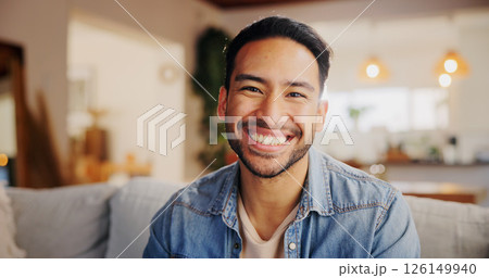 Happy, relax and portrait of man in new home with confidence for property ownership. Smile, pride and male person from India with calm, peace and positive attitude in living room at apartment. 126149940