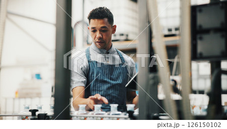Distillery, tablet and man in factory for inspection of alcohol, production and manufacturing checklist. Brewery, industrial and person on digital tech for fermentation, quality control or storage Distillery, tablet and man in factory for inspection of alcohol, production and manufacturing checklist. Brewery, industrial and person on digital tech for fermentation, quality control or storage 126150102