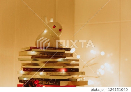 Christmas Tree with Book and Nativity Scene Festive Holiday Decorations and Cozy Seasonal Atmosphere. High quality photo Christmas Tree with Book and Nativity Scene Festive Holiday Decorations and Cozy Seasonal Atmosphere. High quality photo 126151040