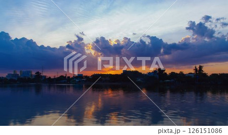 Towering cumulus clouds glowing in golden sunlight against clear blue sky at sunset with dramatic natural cloudscape and atmospheric light. High quality photo Towering cumulus clouds glowing in golden sunlight against clear blue sky at sunset with dramatic natural cloudscape and atmospheric light. High quality photo 126151086