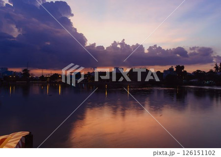 Towering cumulus clouds glowing in golden sunlight against clear blue sky at sunset with dramatic natural cloudscape and atmospheric light. High quality photo Towering cumulus clouds glowing in golden sunlight against clear blue sky at sunset with dramatic natural cloudscape and atmospheric light. High quality photo 126151102