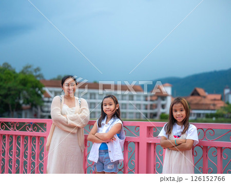 Happy mother and daughter spending time together in a park during spring. Happy mother and daughter spending time together in a park during spring. 126152766