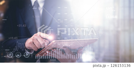 Businessman using digital tablet futuristic financial dashboard. data analyzing report invest strategy planning, stock market growth, investment trends, and fintech innovation business environment. Businessman using digital tablet futuristic financial dashboard. data analyzing report invest strategy planning, stock market growth, investment trends, and fintech innovation business environment. 126153136