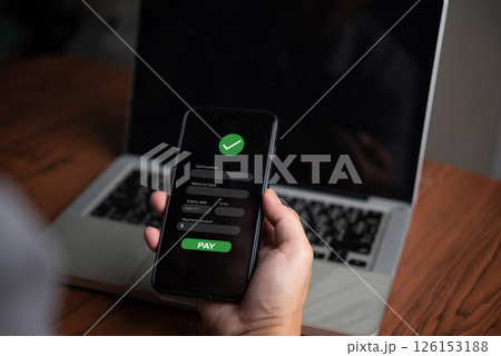 Online payment confirmation on mobile. Digital transaction, e-commerce, fintech, and contactless payment concept. Secure mobile banking and financial technology for fast and safe purchases. Online payment confirmation on mobile. Digital transaction, e-commerce, fintech, and contactless payment concept. Secure mobile banking and financial technology for fast and safe purchases. 126153188