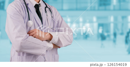 Healthcare worker in uniform with a stethoscope, standing confidently hospital background, representing medical dedication and trust. doctor portrait medical service, suitable hospitals 126154019