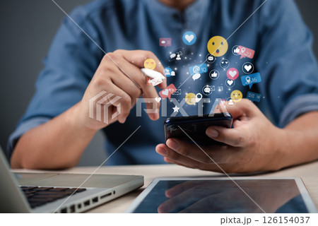 businessman using a smartphone with social media icons floating around, representing digital marketing and online communication. 126154037