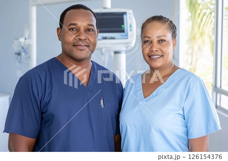 African male and female nurses in hospital setting, medical background 126154376