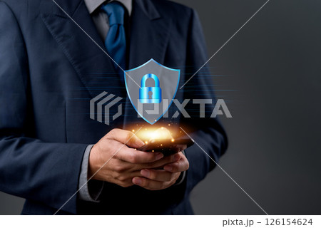 Close-up of hands using a mobile phone with a digital technology cybersecurity icon, representing data encryption, privacy, and secure online access. internet network firewall protect. 126154624