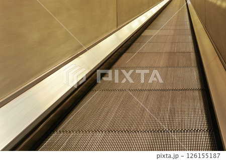 Flat escalator - moving walkway travelator in underground train station Flat escalator - moving walkway travelator in underground train station 126155187