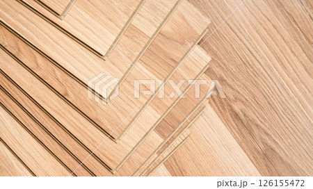 Laminated floor tiles arranged - ready for fitting, view form above 126155472