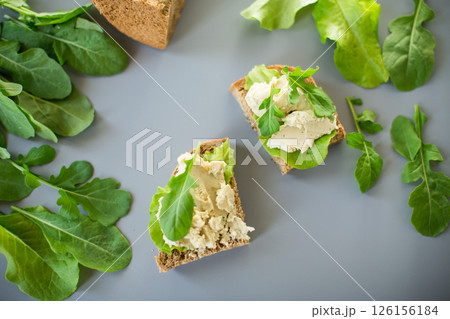 Appetizing sandwich with greens and fish spread 126156184