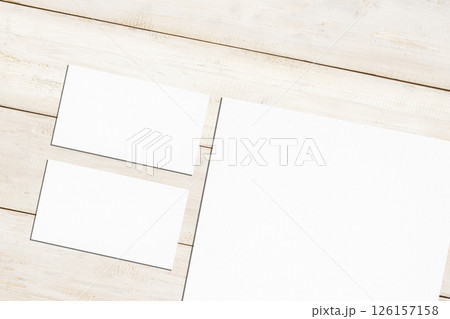 Top view set of business letterhead and business card on a wooden background. Blank paper or sheet. Mockup or copy space for your design 126157158