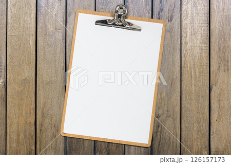 Top view of business letterhead and clipboard on wooden background. Blank paper or sheet. Mockup or copy space for your design 126157173
