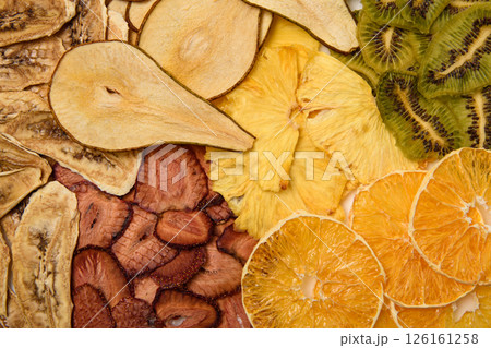 Mix of dried various fruits. Diet food. Natural and healthy snacks. Diet chips made from dried fruits. Mix of dried various fruits. Diet food. Natural and healthy snacks. Diet chips made from dried fruits. 126161258
