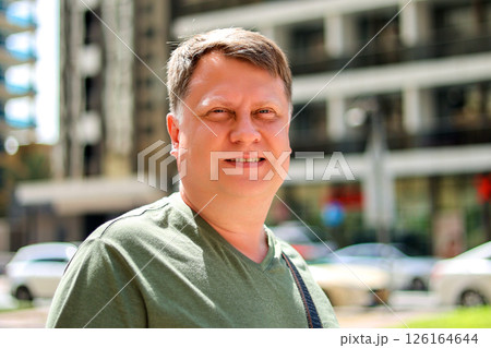 Middle-aged Blond Man in a Bustling City Street, Capturing Urban Life and Energy 126164644