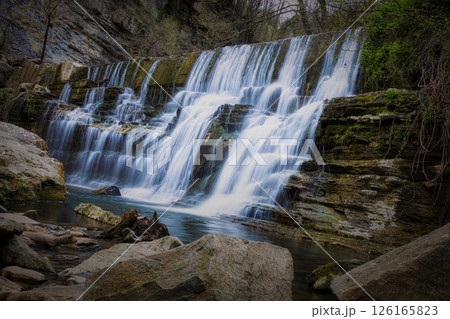 Beautiful creek with waterfalls in Spain in Catalonia, near the small village Rupit. Creek Rupit. Beautiful creek with waterfalls in Spain in Catalonia, near the small village Rupit. Creek Rupit. 126165823