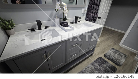 Modern Bathroom Interior Design, Clean and simple bathroom interior showcasing a functional bathtub, modern sink, and neatly arranged amenities for a refreshing and inviting atmosphere Modern Bathroom Interior Design, Clean and simple bathroom interior showcasing a functional bathtub, modern sink, and neatly arranged amenities for a refreshing and inviting atmosphere 126166149