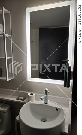 Modern Bathroom Interior Design, Clean and simple bathroom interior showcasing a functional bathtub, modern sink, and neatly arranged amenities for a refreshing and inviting atmosphere 126166152