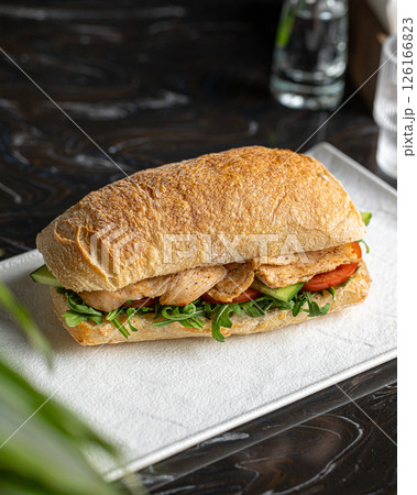 Ciabatta sandwich with chicken and salad 126166823
