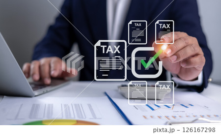 Tax documents and savings, Corporate and individual tax payment concept, Businessman using computer filling out corporate and personal income tax return, VAT of business, Submit request refund tax. Tax documents and savings, Corporate and individual tax payment concept, Businessman using computer filling out corporate and personal income tax return, VAT of business, Submit request refund tax. 126167298